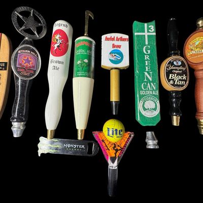 Sale Photo Thumbnail #20: This includes nine vintage beer tap handles, and one Monster bottle opener. Brands include Harpoon, Starr Hill, Miller Lite, and more. [MI]