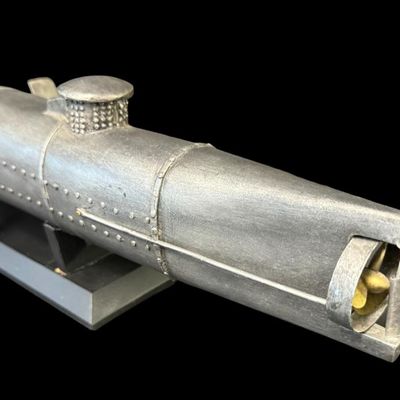 Sale Photo Thumbnail #29: The H.L. Hunley was a hand-powered combat submarine of the Confederate States Army that made history on Feb. 17, 1864, as the first submarine to sink an enemy warship. It was constructed in 1863, and measured approximately 40 feet long. It was forged from