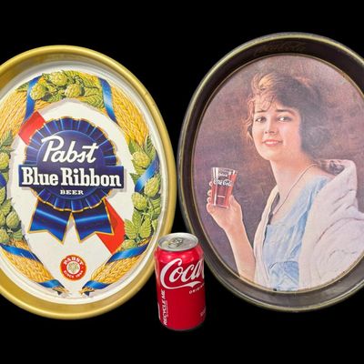 Sale Photo Thumbnail #36: This assortment includes a Coca-Cola tray, a Pabst Blue Ribbon tray, and a Bud Light bucket. Total of three pieces. Measurement of trays: 15” x 12.5”. [MI]