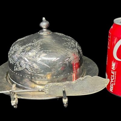 Sale Photo Thumbnail #56: This late 19th century Victorian cheese/butter dome was manufactured by the Meriden B. Company. It is quadruple plated, meaning it has four layers of electro-plated silver, representing higher durability and quality for antique silver plate. It is complet