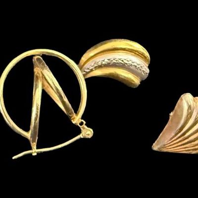 Sale Photo Thumbnail #72: This 14K gold earrings assortment includes a pair of yellow gold twist hoop earrings, a pair of tri-color shell earrings (one has damage), and a single yellow and white gold earring. The total weight is 2.33 grams. The gold content of some items was confi