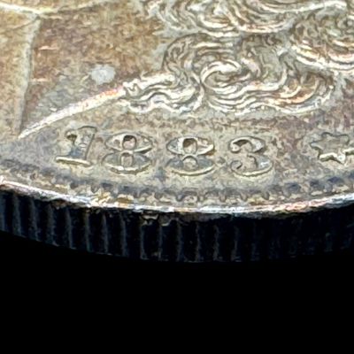 Sale Photo Thumbnail #83: This 1883 Morgan dollar is not graded. The silver content is 90%. [PM]