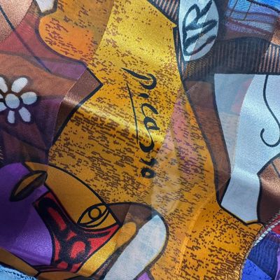 Sale Photo Thumbnail #92: Makers include Picasso, and more. Total of 13 scarves. There are no obvious stains or tears. Some have hand-rolled edges. Measurement of largest: 60” x 13”. [CS]