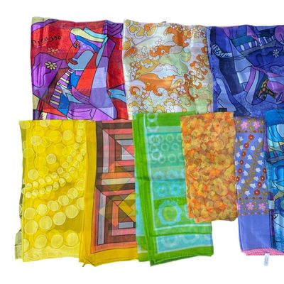 Sale Photo Thumbnail #91: Makers include Picasso, and more. Total of 13 scarves. There are no obvious stains or tears. Some have hand-rolled edges. Measurement of largest: 60” x 13”. [CS]