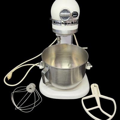 Sale Photo Thumbnail #101: This features all-metal internal gears, and was built during a period when Hobart manufactured KitchenAid appliances. It is complete with a whisk and dough hook. Working at the time of catalog. Measurement: 17” x 13” x 9”. [LG]