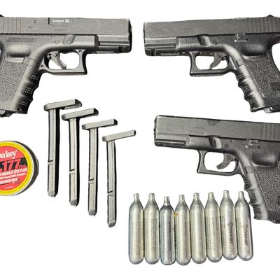 Sale Photo Thumbnail #125: Includes three pistols, four magazines, eight Co2 cylinders, and a tin of Daisy .177 pellets. Co2 cartridges will not be shipped. [GG]