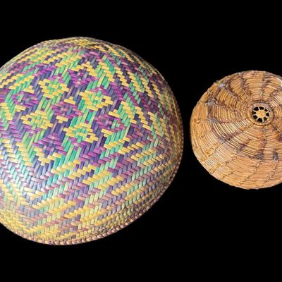 Sale Photo Thumbnail #147: Includes a polychrome Bangchung basket, and a primitive Rye straw basket. There is age related wear, but each basket is still tightly woven. Measurement of largest: 9” Diameter. [AG]
