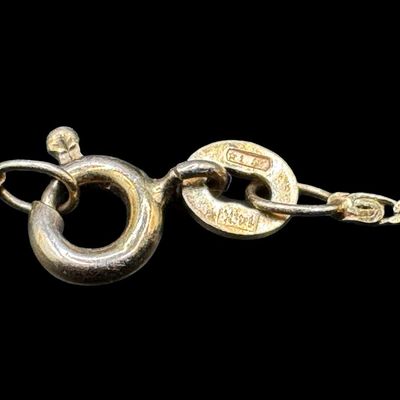 Sale Photo Thumbnail #150: This is a 14K yellow gold scroll chain bracelet. It has distinctive links that are created by two wires spiraling into each other. The length is 7” long. It is stamped “14K, Italy.” The weight is 1.06 grams. [AG]