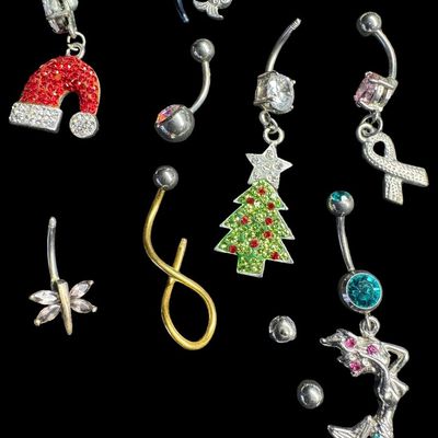 Sale Photo Thumbnail #155: This assortment includes barbells, and more. Motifs include seasonal, mermaids, stones, and more. Some pieces may be incomplete. Total of 30+ pieces. [AG]