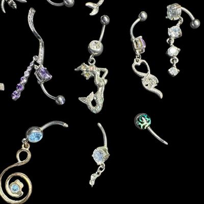 Sale Photo Thumbnail #156: This assortment includes barbells, and more. Motifs include seasonal, mermaids, stones, and more. Some pieces may be incomplete. Total of 30+ pieces. [AG]
