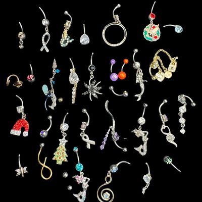 Sale Photo Thumbnail #154: This assortment includes barbells, and more. Motifs include seasonal, mermaids, stones, and more. Some pieces may be incomplete. Total of 30+ pieces. [AG]