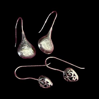 Sale Photo Thumbnail #164: This sterling silver earrings assortment includes a pair of hoop earrings, and two pairs of drop earrings. Total of three pairs of earrings. The total weight is 9.71 grams. The silver content of some pieces may have been confirmed with testing. [AG]