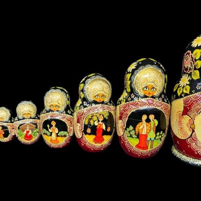 Sale Photo Thumbnail #194: This set includes a total of ten dolls. They feature detailed, ornate painted dolls with gold accents, floral motifs, and traditional scenes. The tallest doll measures 9 inches high. [AG]
