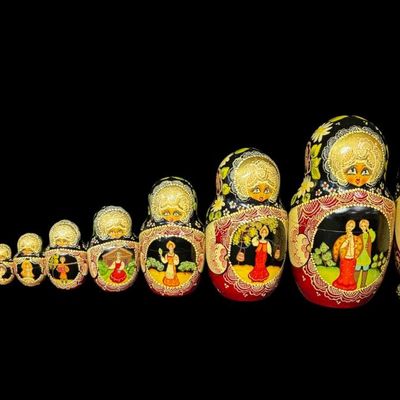 Sale Photo Thumbnail #195: This set includes a total of ten dolls. They feature detailed, ornate painted dolls with gold accents, floral motifs, and traditional scenes. The tallest doll measures 9 inches high. [AG]