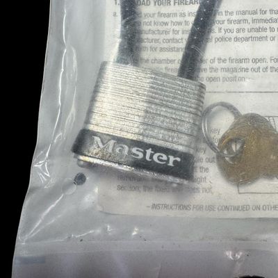 Sale Photo Thumbnail #207: Includes Ruger, Mossberg, Master, and more. Total of ten pieces. Each lock has the original keys and packaging. [GG]