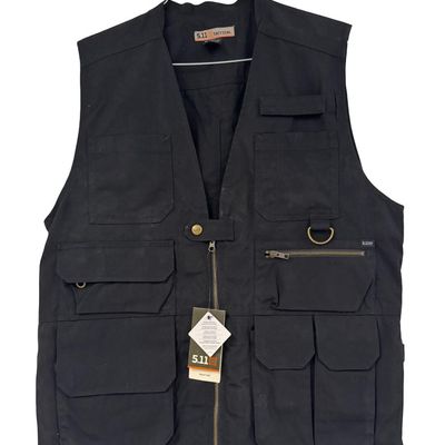 Sale Photo Thumbnail #211: The Taclite vest features nearly 20 pockets, and has double, triple, and quad stitching. It is built to haul everything you need for some serious adventure. It has hidden CCW pockets, map pockets, and more. The size is Large. This vest is new, with tags. 