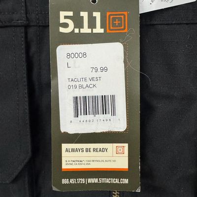 Sale Photo Thumbnail #212: The Taclite vest features nearly 20 pockets, and has double, triple, and quad stitching. It is built to haul everything you need for some serious adventure. It has hidden CCW pockets, map pockets, and more. The size is Large. This vest is new, with tags. 