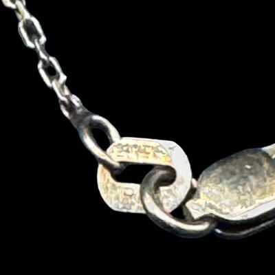 Sale Photo Thumbnail #233: This sterling silver assortment includes a bracelet, a brooch, a cable chain with a gold vermeil wash, and three single earrings. The chain length is 20 inches. The total weight is 22.28 grams. The silver content of some pieces was verified with testing. 