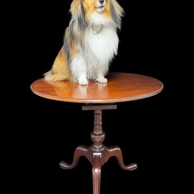 Sale Photo Thumbnail #298: This table is complete, and functions as it should. It is mahogany in color. There is a crack on the top of the pedestal base (pictured). Measurement: 28”H x 30” Diameter. [VB]