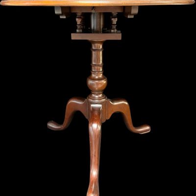 Sale Photo Thumbnail #299: This table is complete, and functions as it should. It is mahogany in color. There is a crack on the top of the pedestal base (pictured). Measurement: 28”H x 30” Diameter. [VB]
