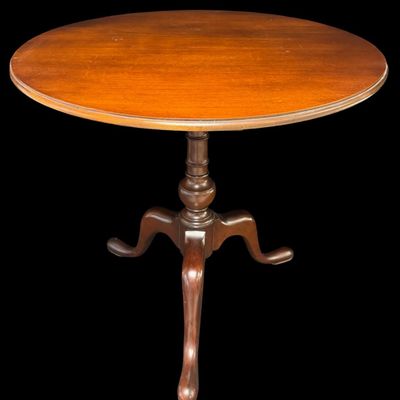 Sale Photo Thumbnail #300: This table is complete, and functions as it should. It is mahogany in color. There is a crack on the top of the pedestal base (pictured). Measurement: 28”H x 30” Diameter. [VB]