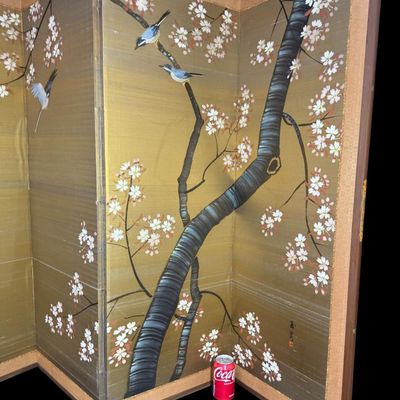 Sale Photo Thumbnail #312: This decorative four-panel screen depicts a classic seasonal nature scene, featuring blossoming cherry trees and songbirds. There is general age related wear, but no rips or tears to the silk. Measurement: 48” x 64” (open, approximate). [VB]
