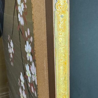 Sale Photo Thumbnail #311: This decorative four-panel screen depicts a classic seasonal nature scene, featuring blossoming cherry trees and songbirds. There is general age related wear, but no rips or tears to the silk. Measurement: 48” x 64” (open, approximate). [VB]