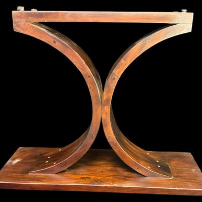 Sale Photo Thumbnail #320: This table features an abstract hourglass or intersecting dual-arch pedestal base. The fluid geometry of this piece mimics mid-century modern and Art Deco aesthetics. There is age related wear. Measurement: 40”W x 31”H. [VB]