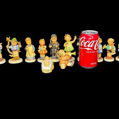 Sale Photo Thumbnail #336: Includes a total of 17 Hummel figurines. All were made by Goebel of Germany. There may or may not be flea bites to some of the figurines. Measurement of tallest: 4.5”H. [AG]