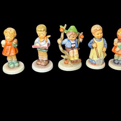 Sale Photo Thumbnail #334: Includes a total of 17 Hummel figurines. All were made by Goebel of Germany. There may or may not be flea bites to some of the figurines. Measurement of tallest: 4.5”H. [AG]