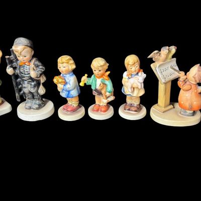 Sale Photo Thumbnail #335: Includes a total of 17 Hummel figurines. All were made by Goebel of Germany. There may or may not be flea bites to some of the figurines. Measurement of tallest: 4.5”H. [AG]
