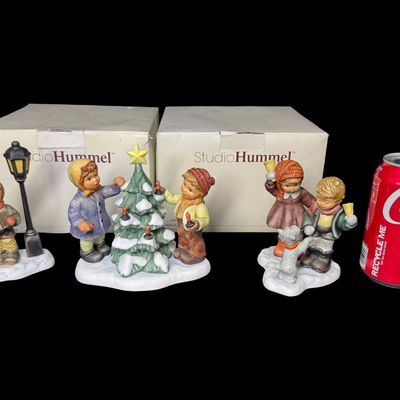 Sale Photo Thumbnail #342: Includes Jingling Bells, Caroling Through the Night, and O Christmas Tree. Total of three figurines, produced in Thailand by Goebel. There is general age related wear. Measurement of tallest: 5.25”H. [AG]
