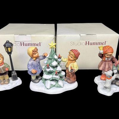 Sale Photo Thumbnail #341: Includes Jingling Bells, Caroling Through the Night, and O Christmas Tree. Total of three figurines, produced in Thailand by Goebel. There is general age related wear. Measurement of tallest: 5.25”H. [AG]