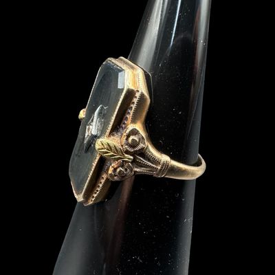 Sale Photo Thumbnail #364: This Victorian-era ladies’ ring features a rectangular piece of black onyx set in yellow gold, centered with a miner cut accent diamond mounted in a white gold frame. The mourning ring symbolized remembrance, grief, or elegant sentimentality. The ring s