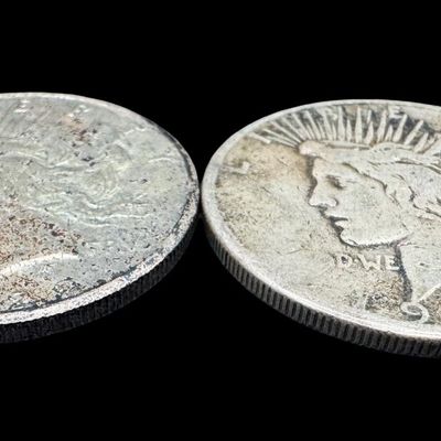 Sale Photo Thumbnail #382: Includes a 1922-S Peace dollar, and a 1923-S Peace dollar. Total of two ungraded coins. The silver content is 90%. [PM]