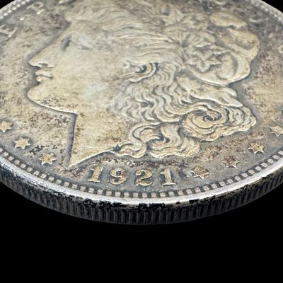 Sale Photo Thumbnail #420: This 1921-D Morgan is not graded. The silver content is 90%. [PM]