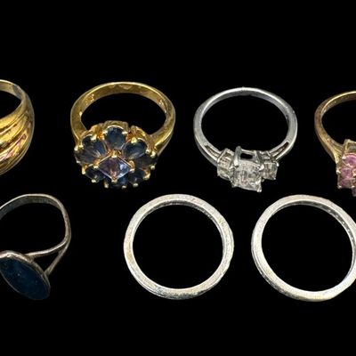 Sale Photo Thumbnail #424: Includes onyx, Long Blue topaz, CZ, and more. Some pieces have a gold vermeil wash. Total of seven rings. The total weight is 26.00 grams. [GG]