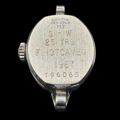 Sale Photo Thumbnail #430: This is a Bulova M7 manual wind ladies’ watch, in 14K white gold, made in 1967. It has 23 jewels. It has been personalized on the reverse. The watch was not tested, and may be over-wound. The original band is missing. The overall weight, including movem