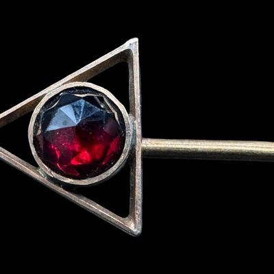 Sale Photo Thumbnail #432: Includes a 14K yellow gold stick pin with a garnet, a 10K yellow gold Shriners pin, and a 10K white gold “Walgreen” pin with three citrine stones. Weight of 14K: 1.33 grams. Weight of 10K: 2.07 grams. The pin backs were removed before weighing. The go