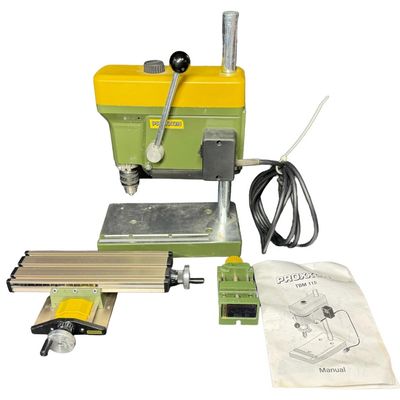 Sale Photo Thumbnail #448: This is a highly precise tabletop power tool engineered specifically for micro-hole drilling in model making, jewelry, electronics, and other fine projects. It operates between 1800 and 8500 rpm. Working at the time of catalog. [RS]