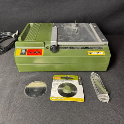 Sale Photo Thumbnail #455: This is made of a surface-milled, die-cast aluminum measuring 160mm x 160mm. It is a compact miniature table saw engineered for precise straight cuts in delicate materials like wood, plastics, and non-ferrous metals. It is primarily used for model buildin