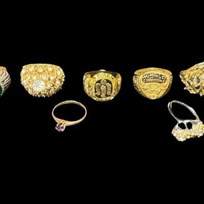 Sale Photo Thumbnail #476: Includes gold tone, silver tone, stones, faux pearls, and more. There are both men’s and ladies’ rings in various styles. Total of ten rings. [PM]