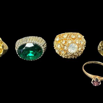 Sale Photo Thumbnail #478: Includes gold tone, silver tone, stones, faux pearls, and more. There are both men’s and ladies’ rings in various styles. Total of ten rings. [PM]
