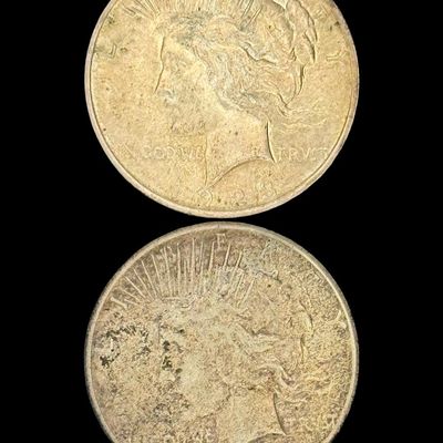 Sale Photo Thumbnail #503: Includes a 1923 Peace dollar, and a 1923-S Peace dollar. Total of two ungraded coins. The silver content is 90%. [PM]