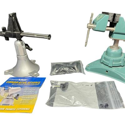 Sale Photo Thumbnail #514: Includes a PanaVise Junior Model 201 adjustable vise, and an articulated vacuum base vise with suction. Both pieces are believed to be constructed of cast aluminum. Includes accessories. Measurement of tallest: 6.5”H. [RS]