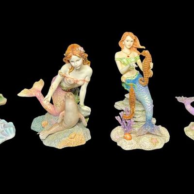Sale Photo Thumbnail #519: Includes Ashtyn, Taylor, Nycole, and Courtney. Total of four colorful mermaids, with resin construction. Measurement of tallest: 6.5”H. [AG]