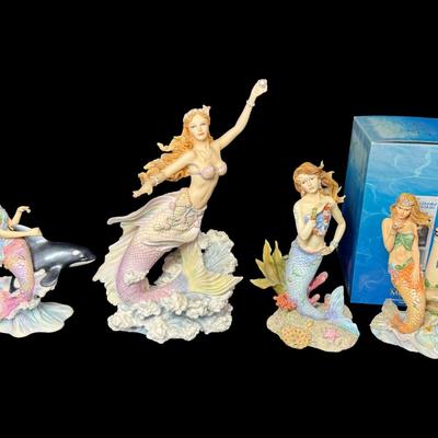 Sale Photo Thumbnail #524: Includes Courtney, Kyra, Mya, and more. Total of four colorful mermaids, with resin construction. Measurement of tallest: 10.25”H. [AG]