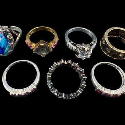 Sale Photo Thumbnail #536: Includes enamel, tourmaline, spinel, and more. Total of seven rings. Some have a 14k gold vermeil wash. The total weight is 30.92 grams. [GG]