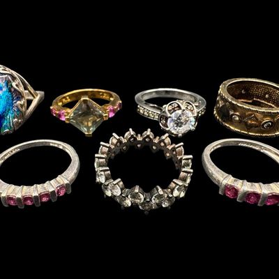 Sale Photo Thumbnail #535: Includes enamel, tourmaline, spinel, and more. Total of seven rings. Some have a 14k gold vermeil wash. The total weight is 30.92 grams. [GG]