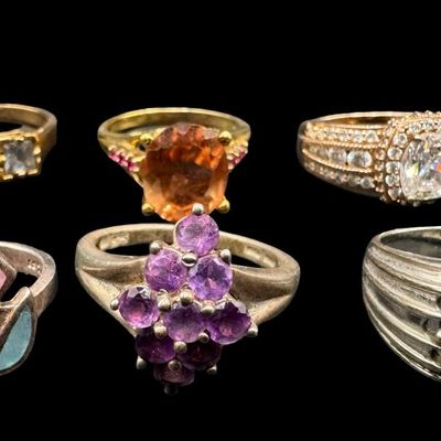 Sale Photo Thumbnail #537: Includes colored moonstone, amethyst, CZ, and more. Total of six rings. Some have a 14K gold vermeil wash. The total weight is 29.81 grams. [GG]